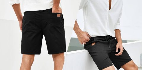 A man wearing shorts and a white shirt