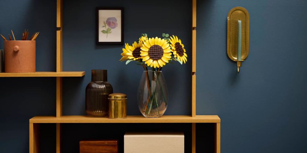 A vase with sunflowers on a shelf