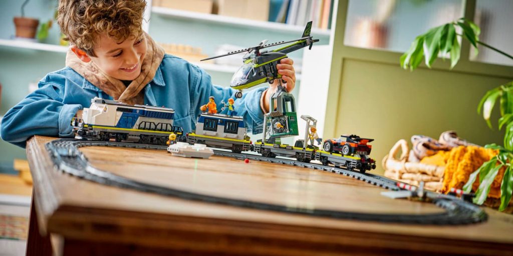 A boy playing with toy train