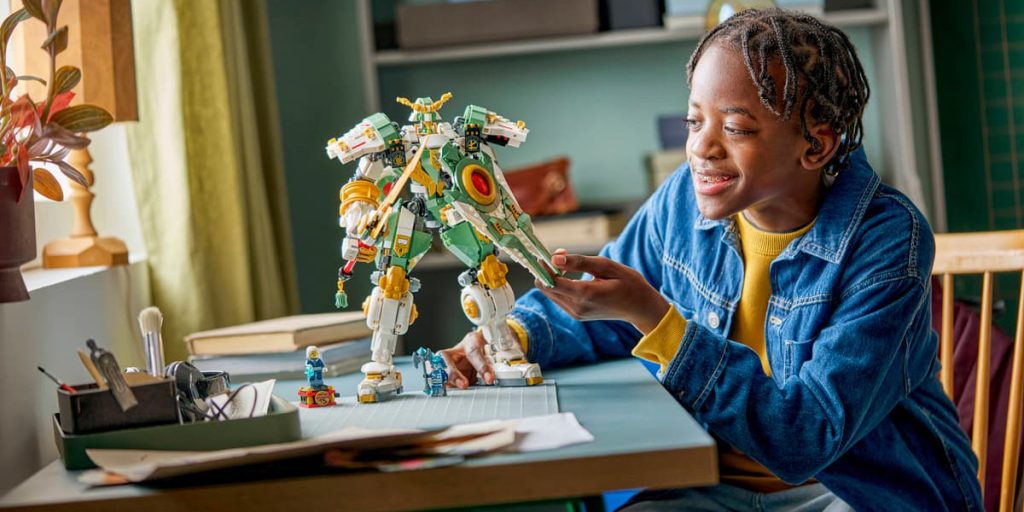 A girl looking at a robot