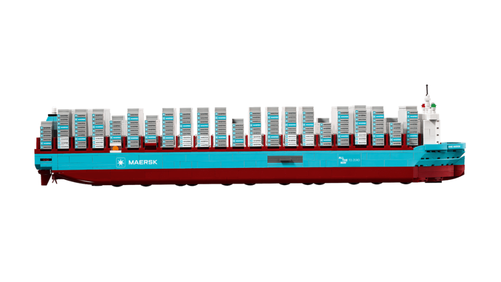 A large LEGO Maersk container ship with many white and blue objects