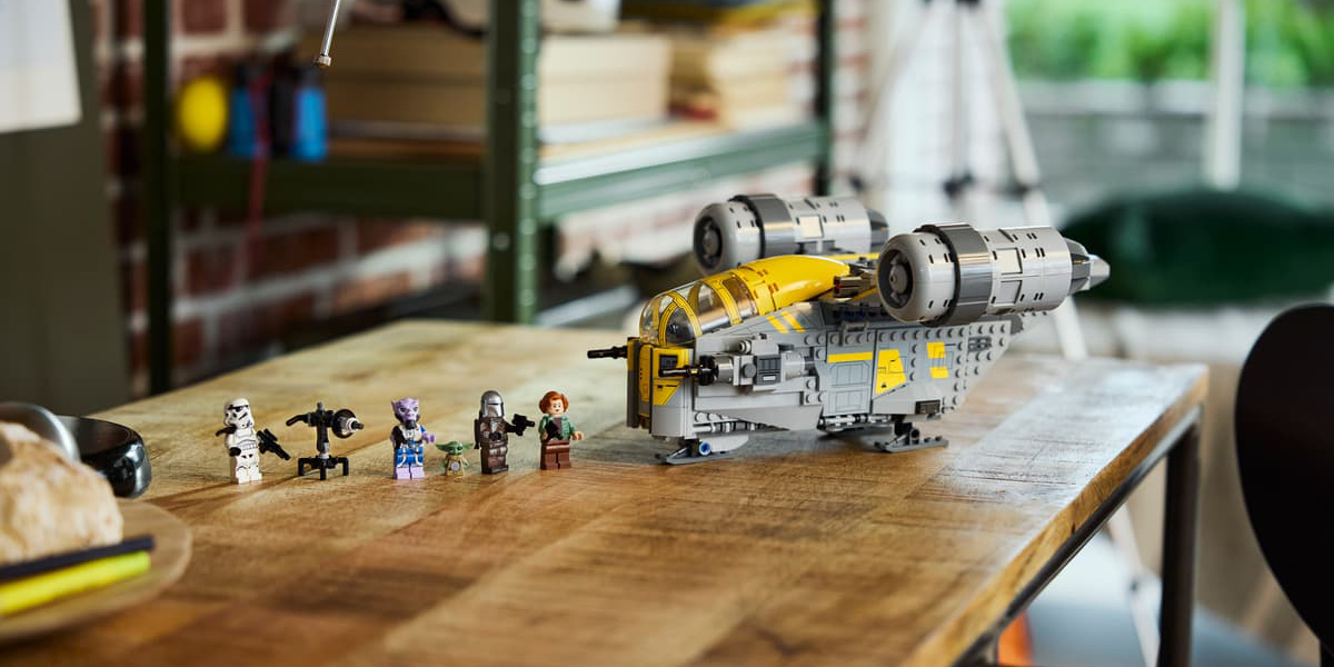 A toy plane with people next to it