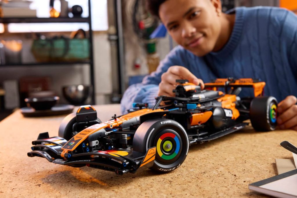 A man working on a LEGO Technic McLaren MCL39