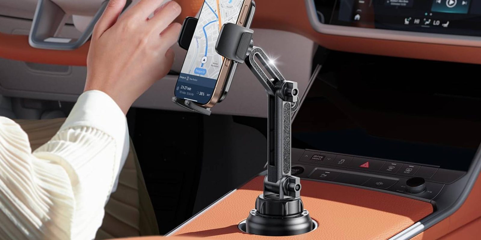 A phone on a holder in a car