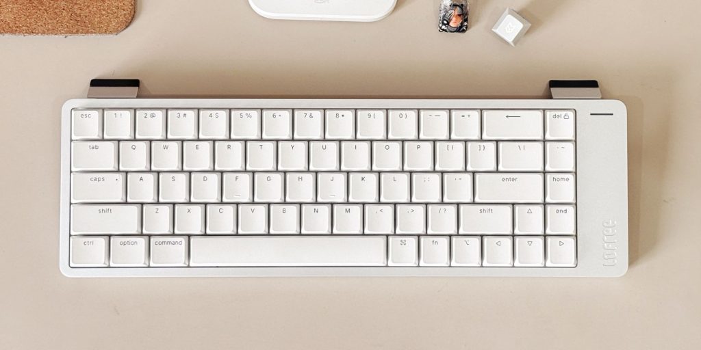 A white keyboard and mouse on a table