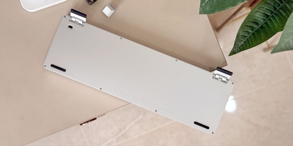 A white rectangular object with black hinges