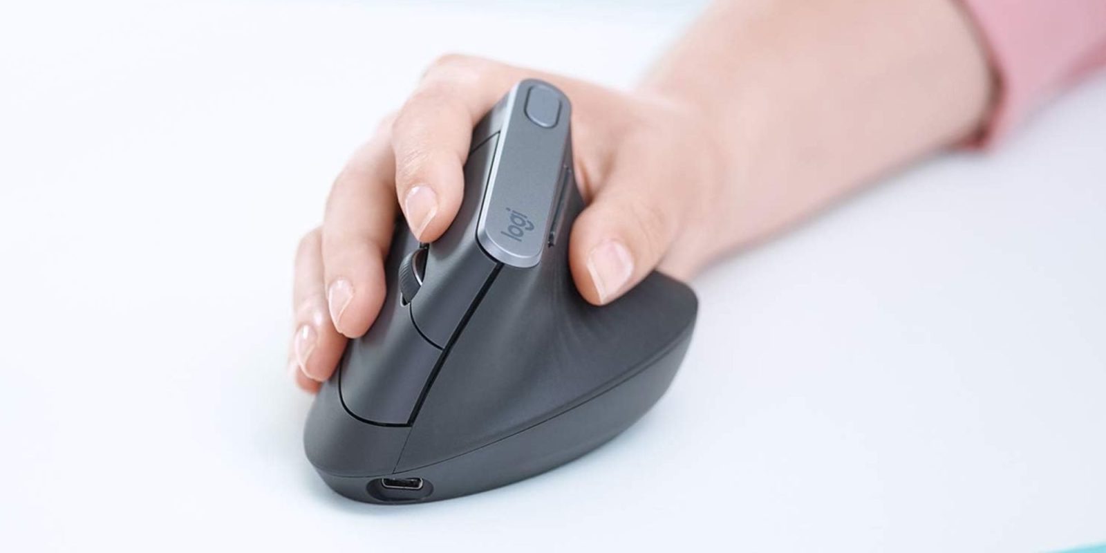 Image showing a person using Logitech's MX Vertical mouse.