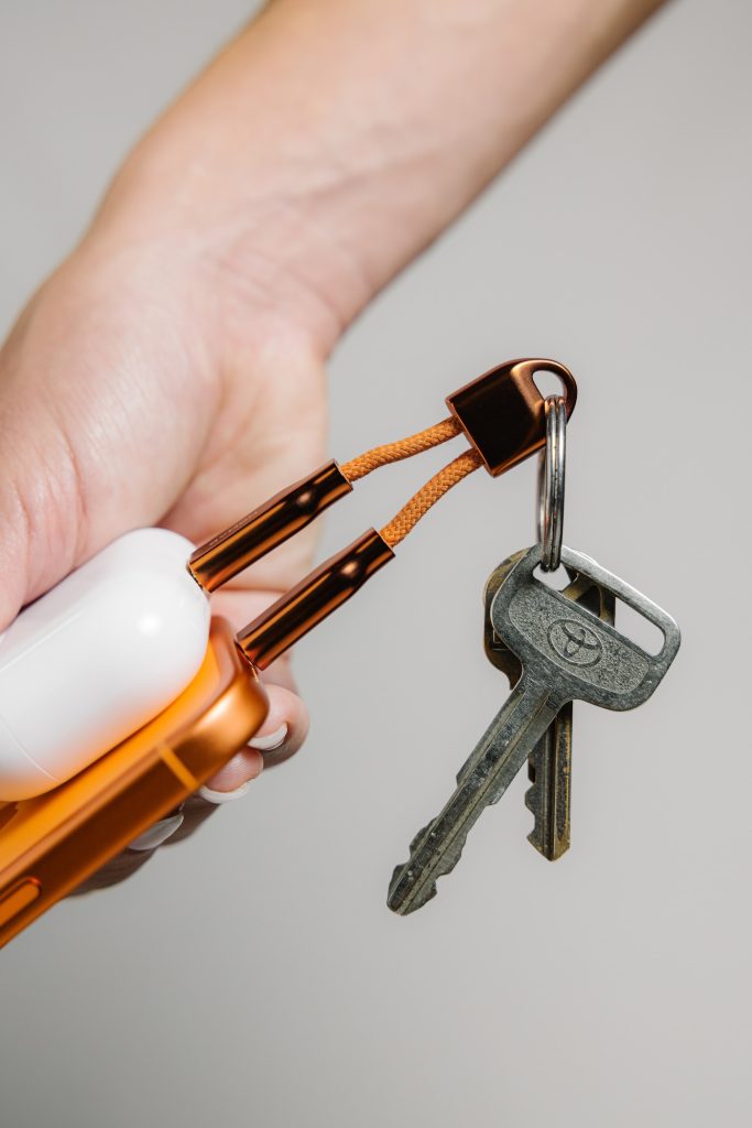 A hand holding a key chain