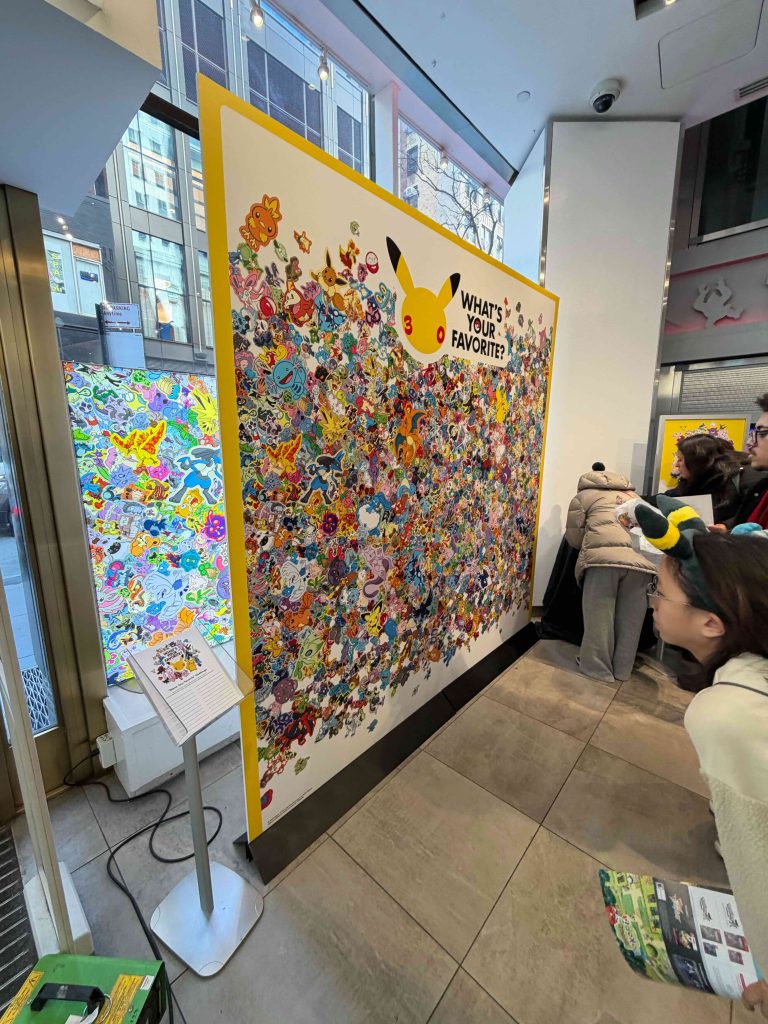 A group of people looking at a large art piece