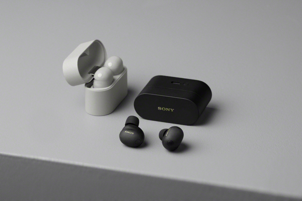 A black and white wireless earbuds