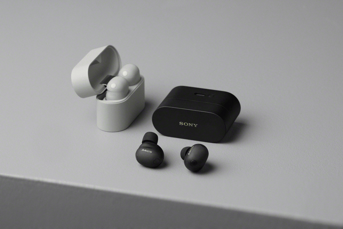 A black and white wireless earbuds
