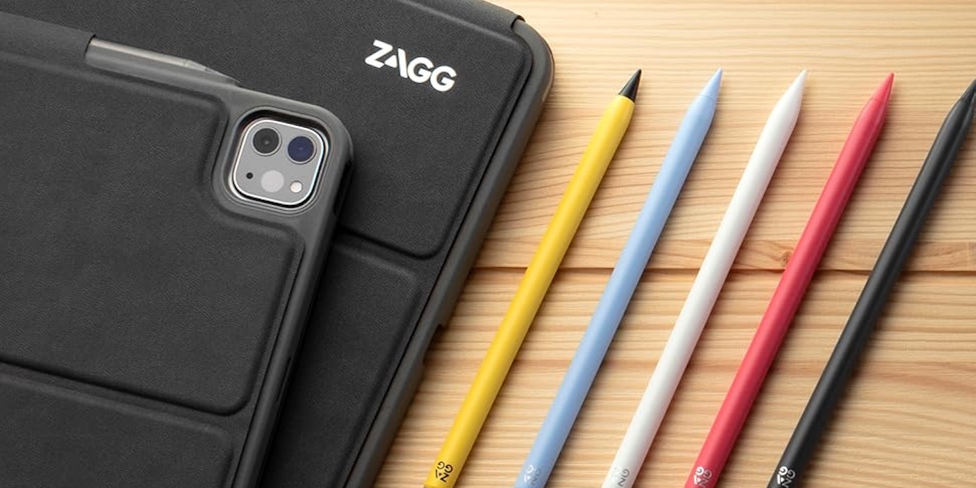 A cell phone and pencils on a table