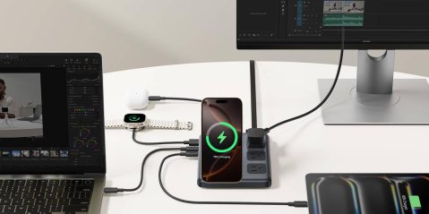 A phone and a watch connected to a power strip