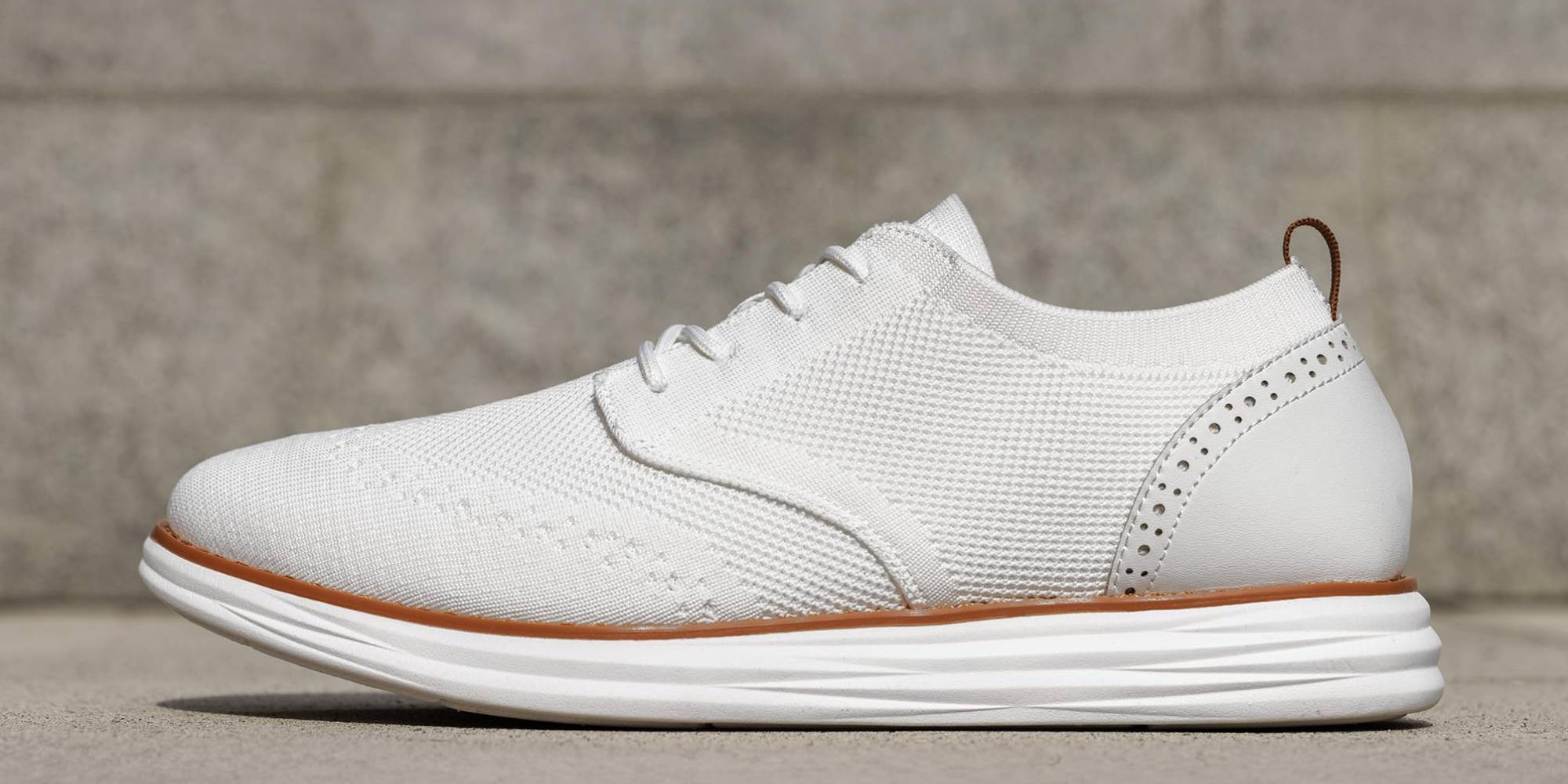 A white shoe on a concrete surface