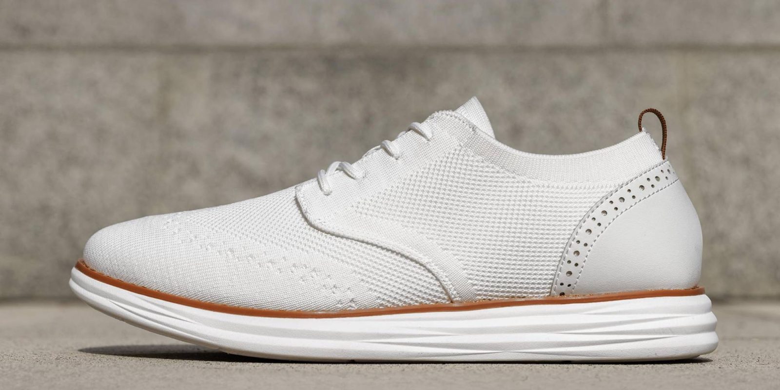 A white shoe on a concrete surface