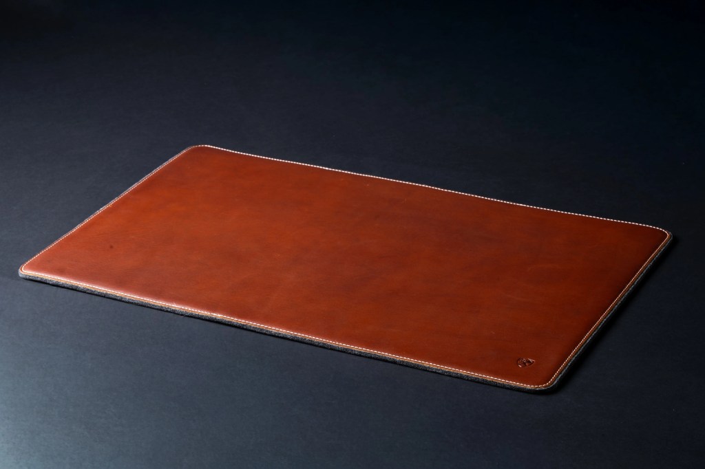 A brown leather mouse pad