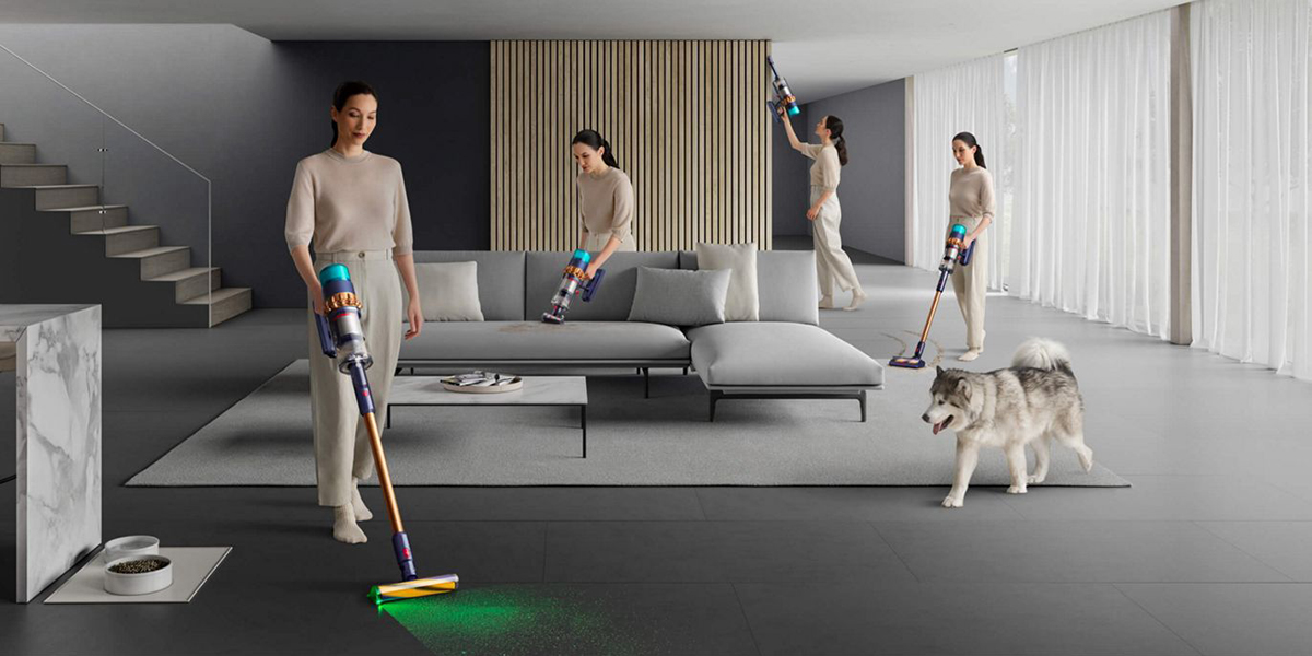 A group of women cleaning a room with vacuum cleaners