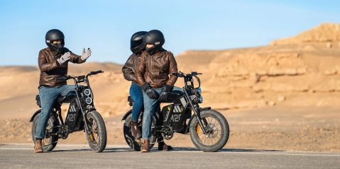 A couple of people on a motorcycle
