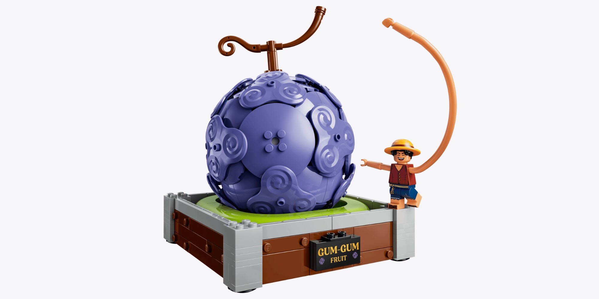 A toy figurine of a man and a purple ball