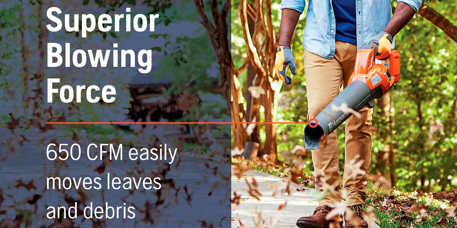 A man holding a leaf blower