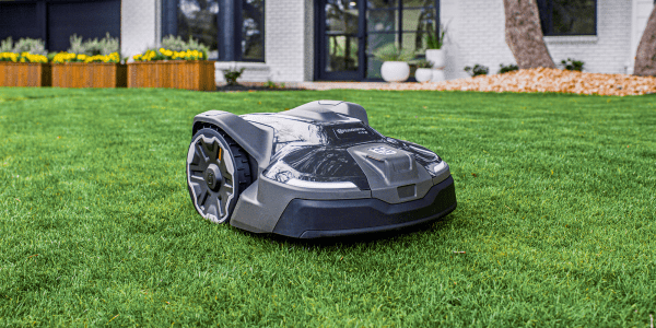 A robot lawnmower on grass