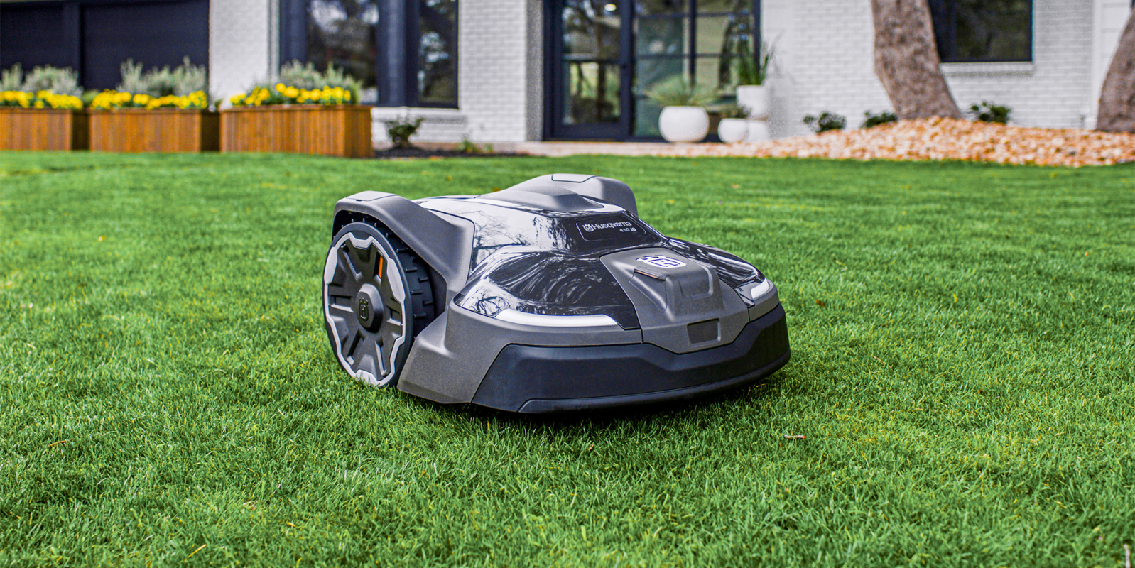 A robot lawnmower on grass