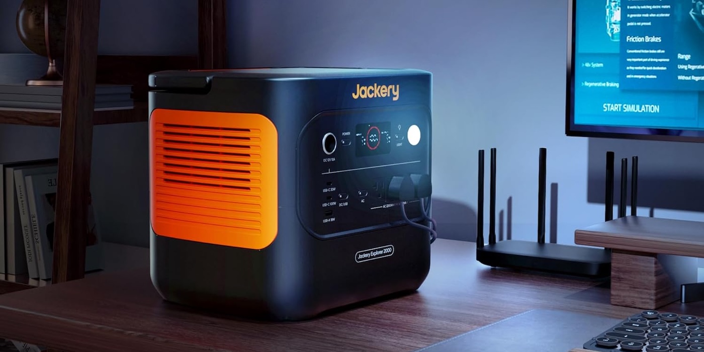 A black and orange cube with buttons and a router