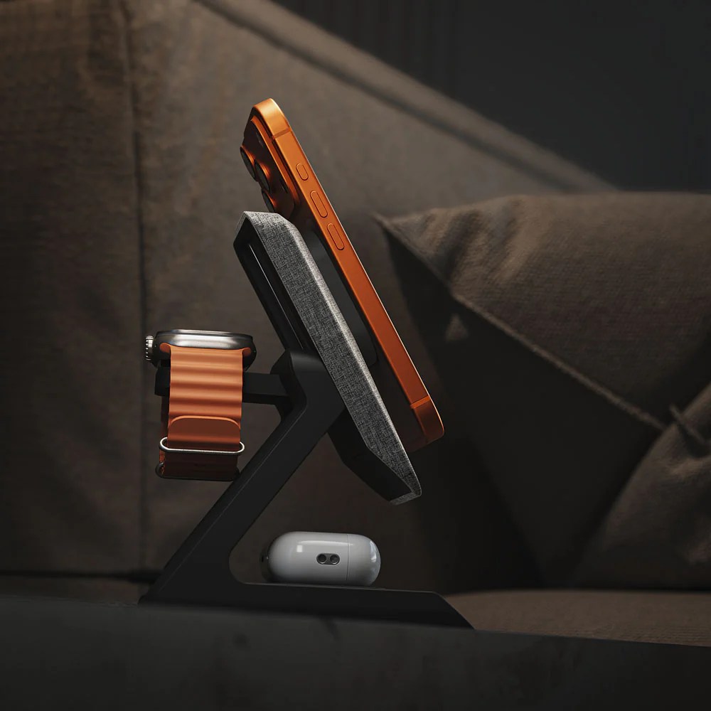 A phone and watch on a stand