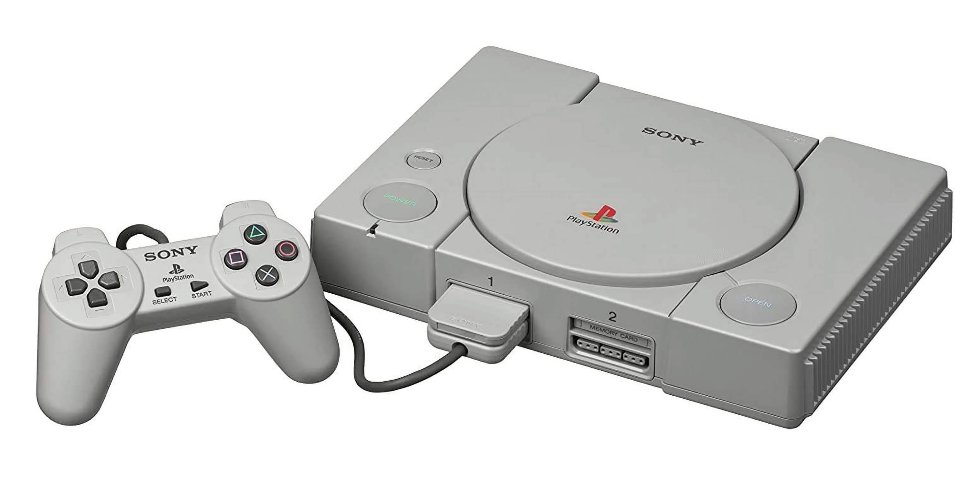 A grey gaming console with a controller