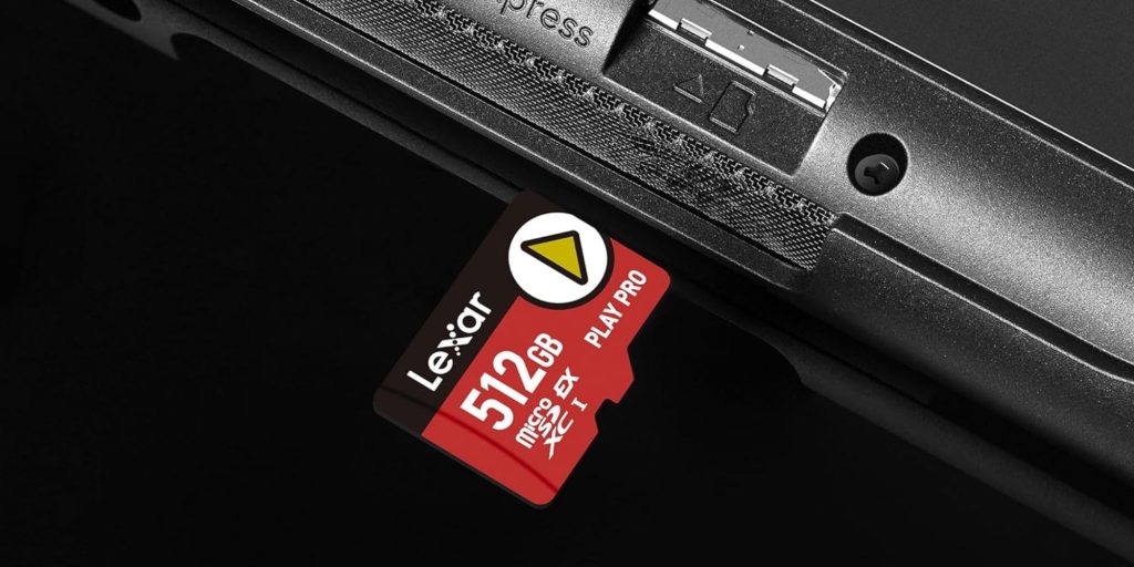 A memory card next to a black device