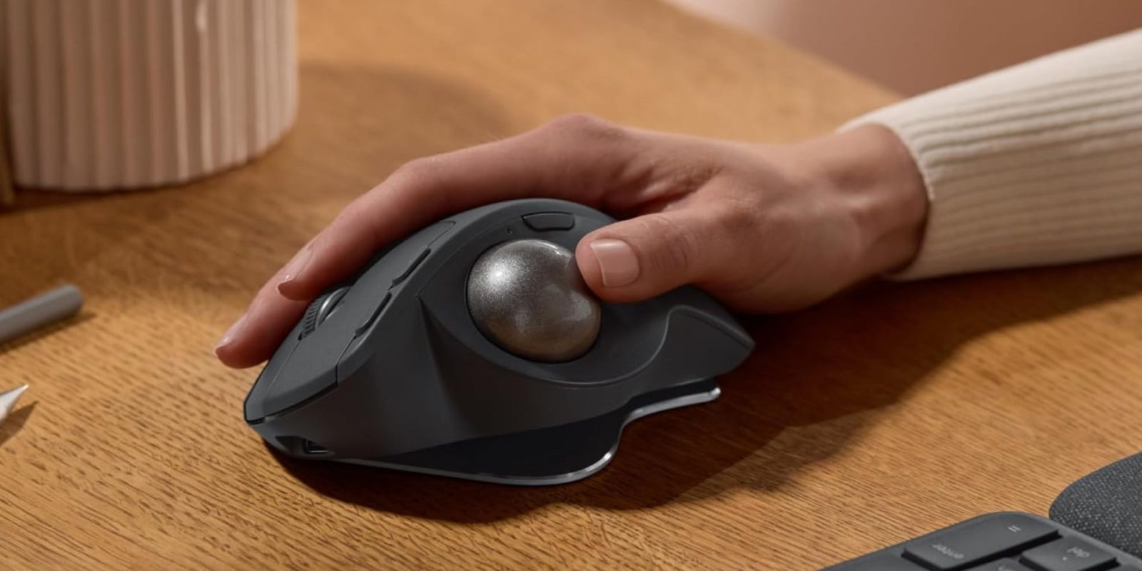 Image showing a person using Logitech's Ergo S Advanced trackball mouse.