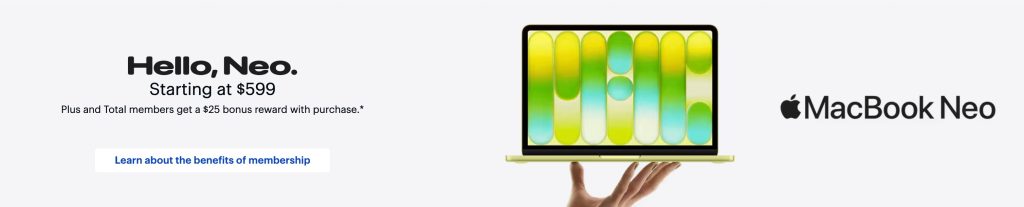 A hand holding a laptop