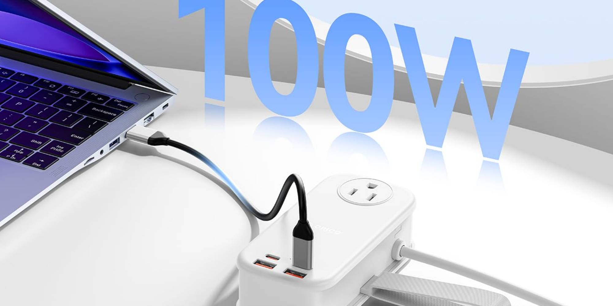 A white rectangular device with a black cord plugged into it