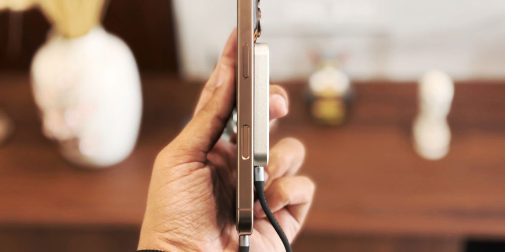 A hand holding a cell phone