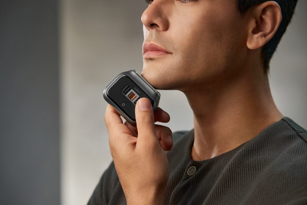 A man holding a shaver