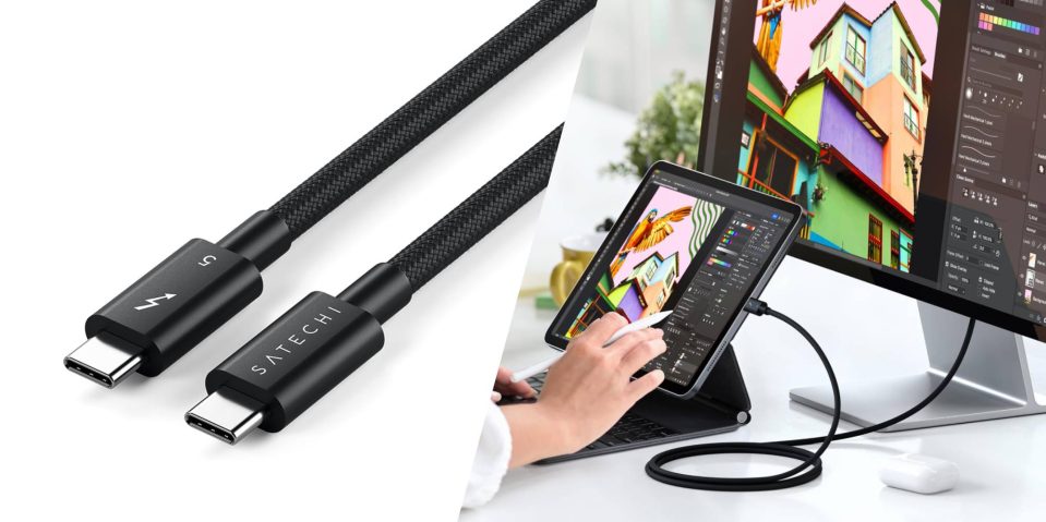 A hand holding a stylus and a tablet