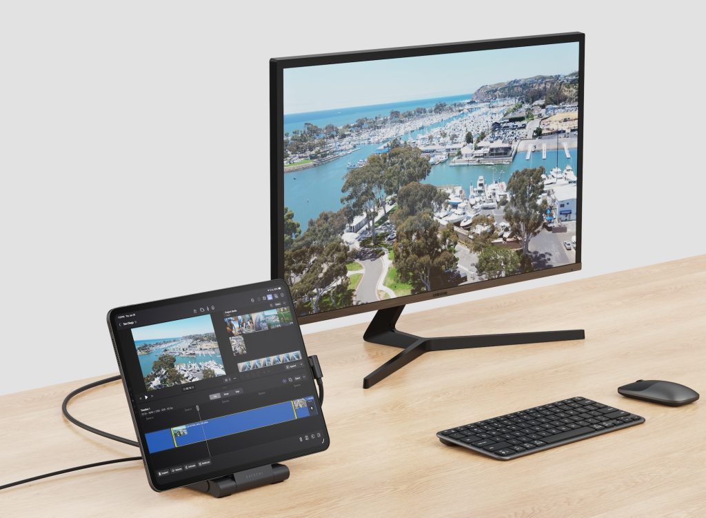 A computer monitor and keyboard on a desk