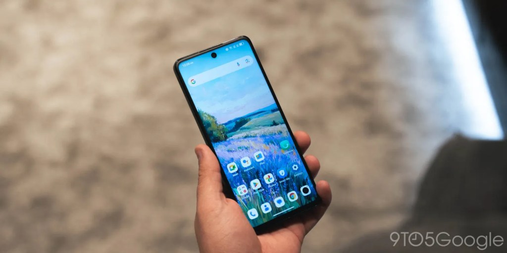 A hand holding a cell phone