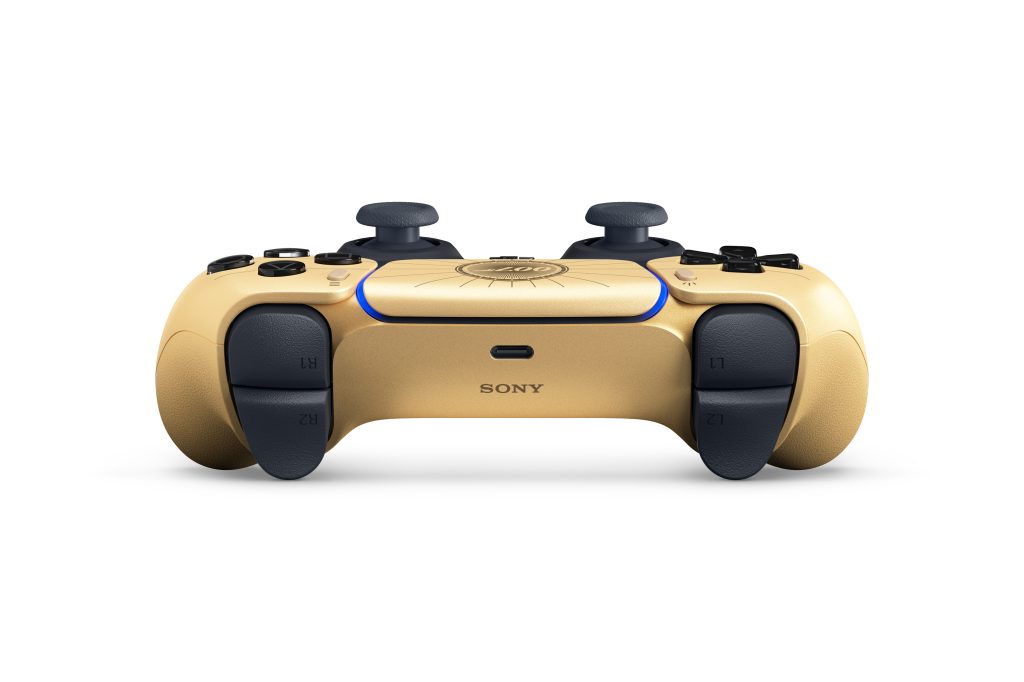 A gold and black video game controller