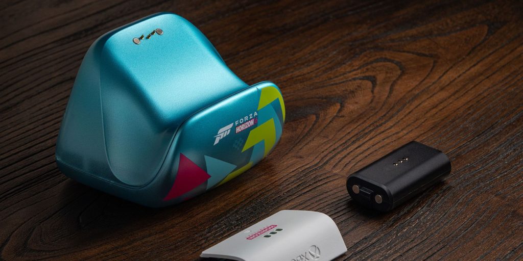 A blue device next to a black battery