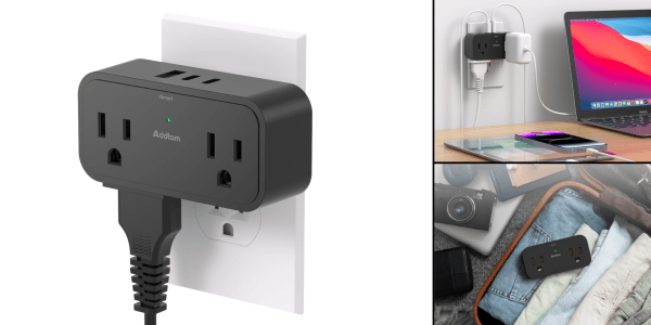 A black electrical outlet with a plug in