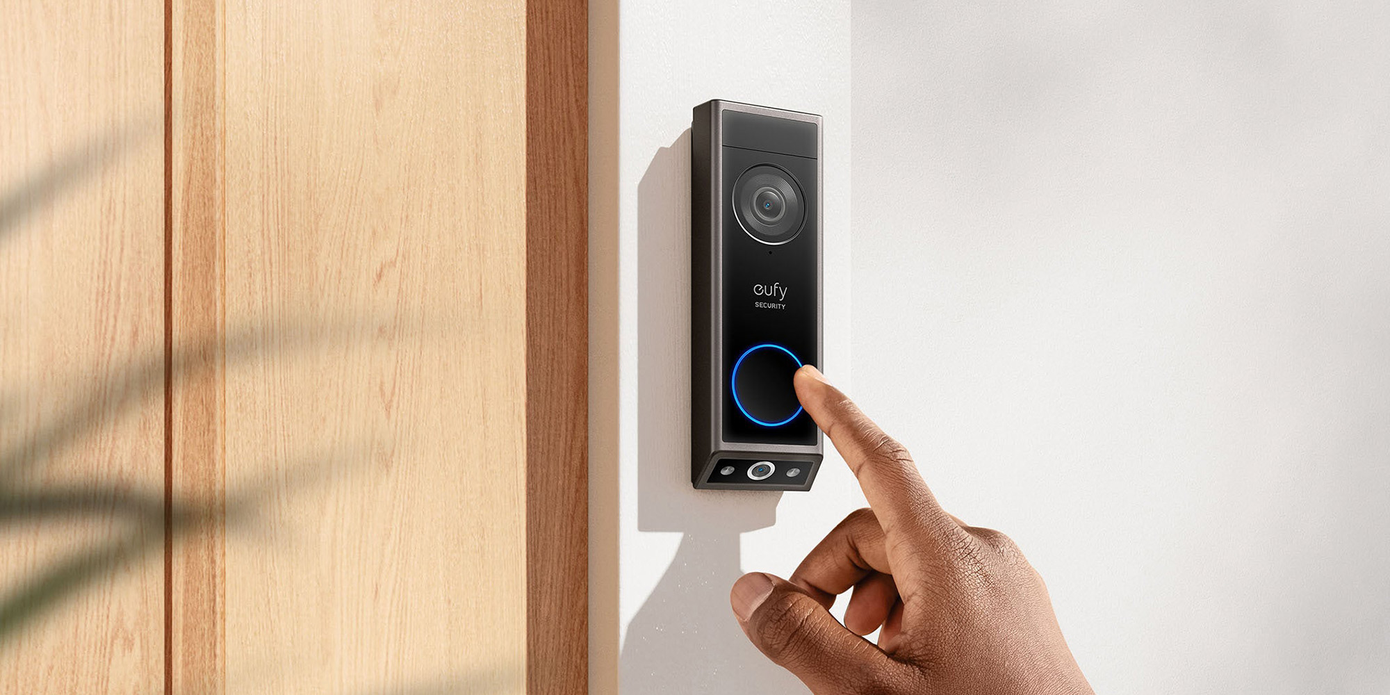 A hand pressing a button on a device