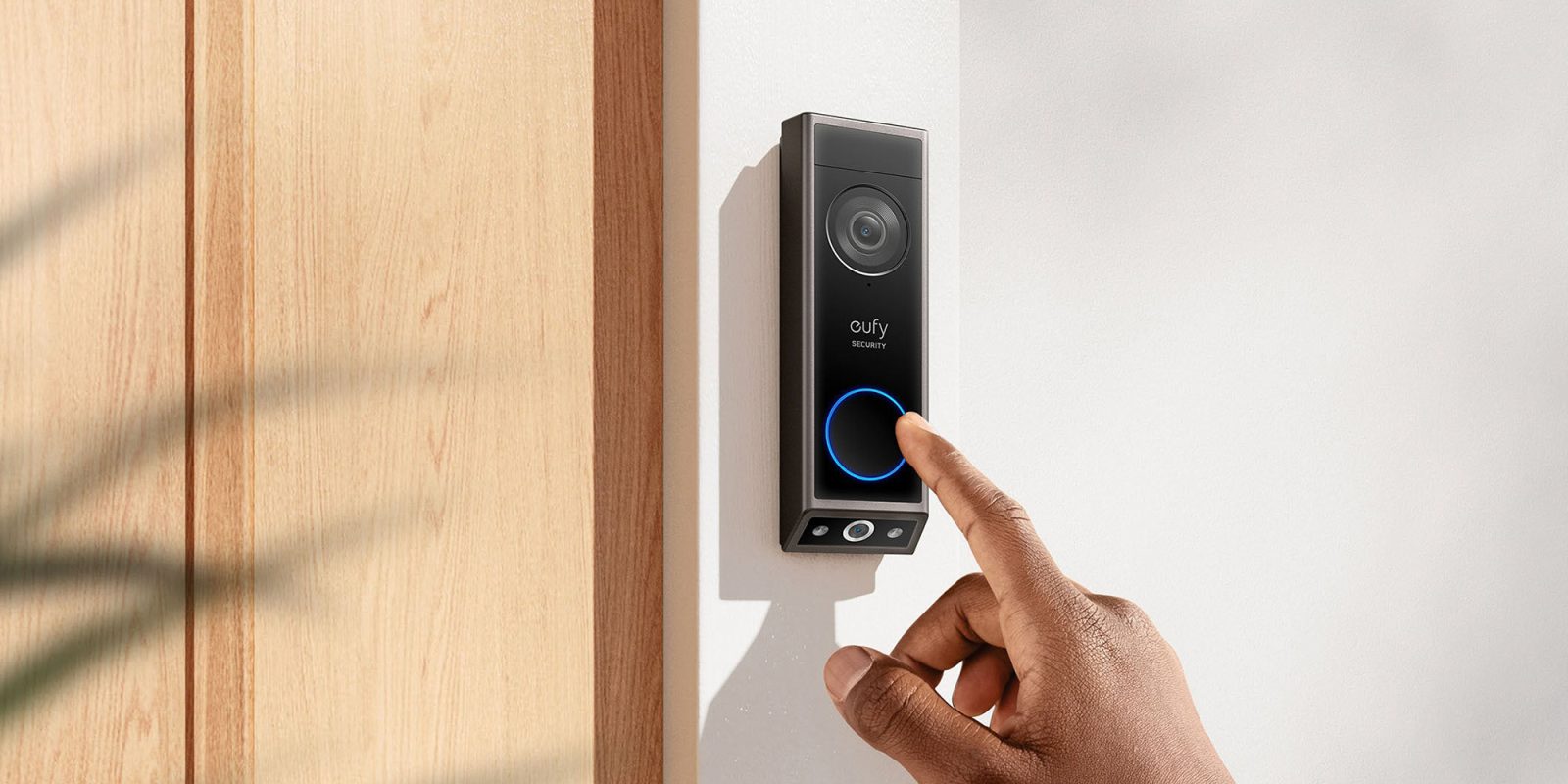 A hand pressing a button on a device