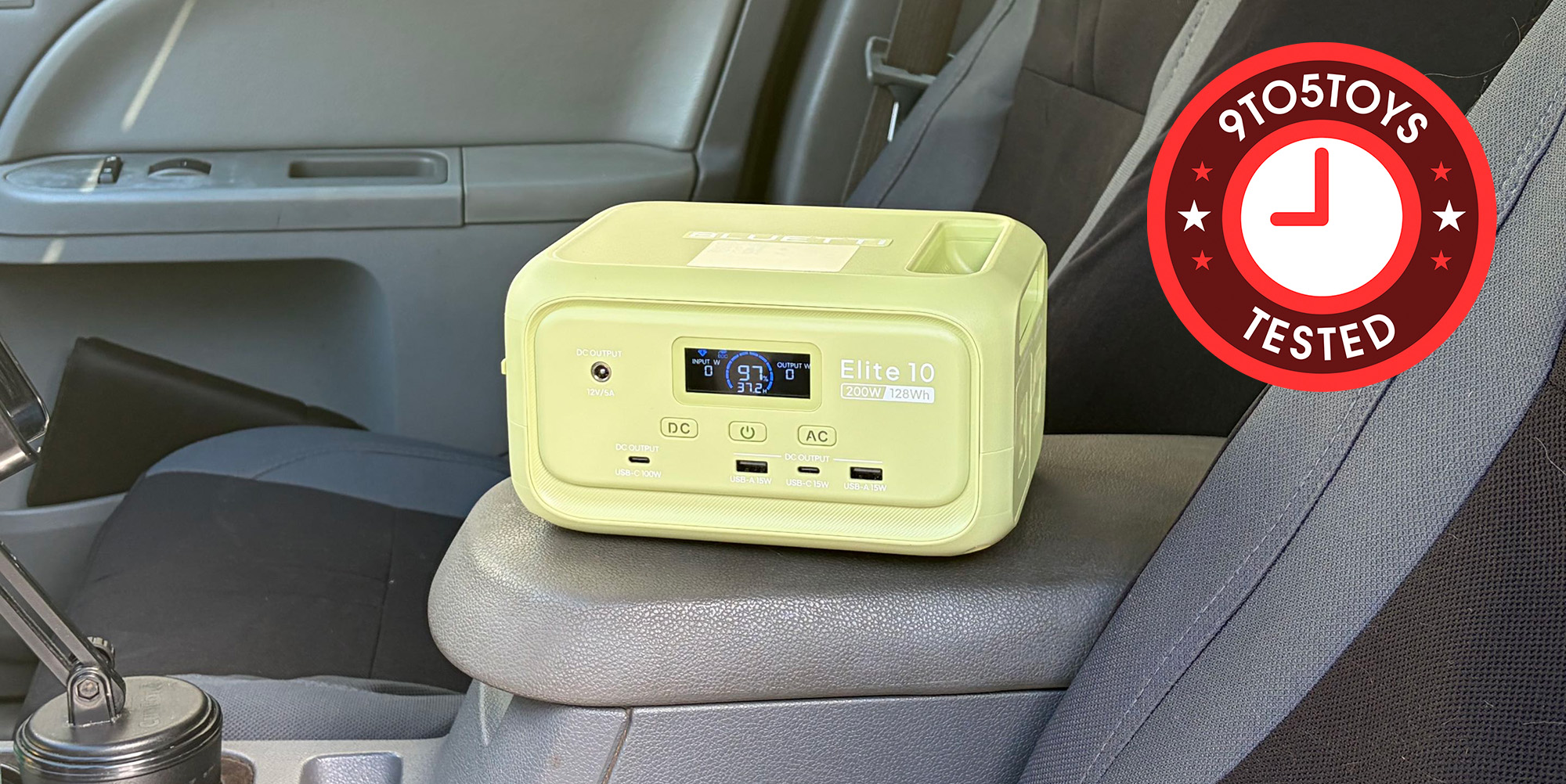 A yellow radio on a car arm rest