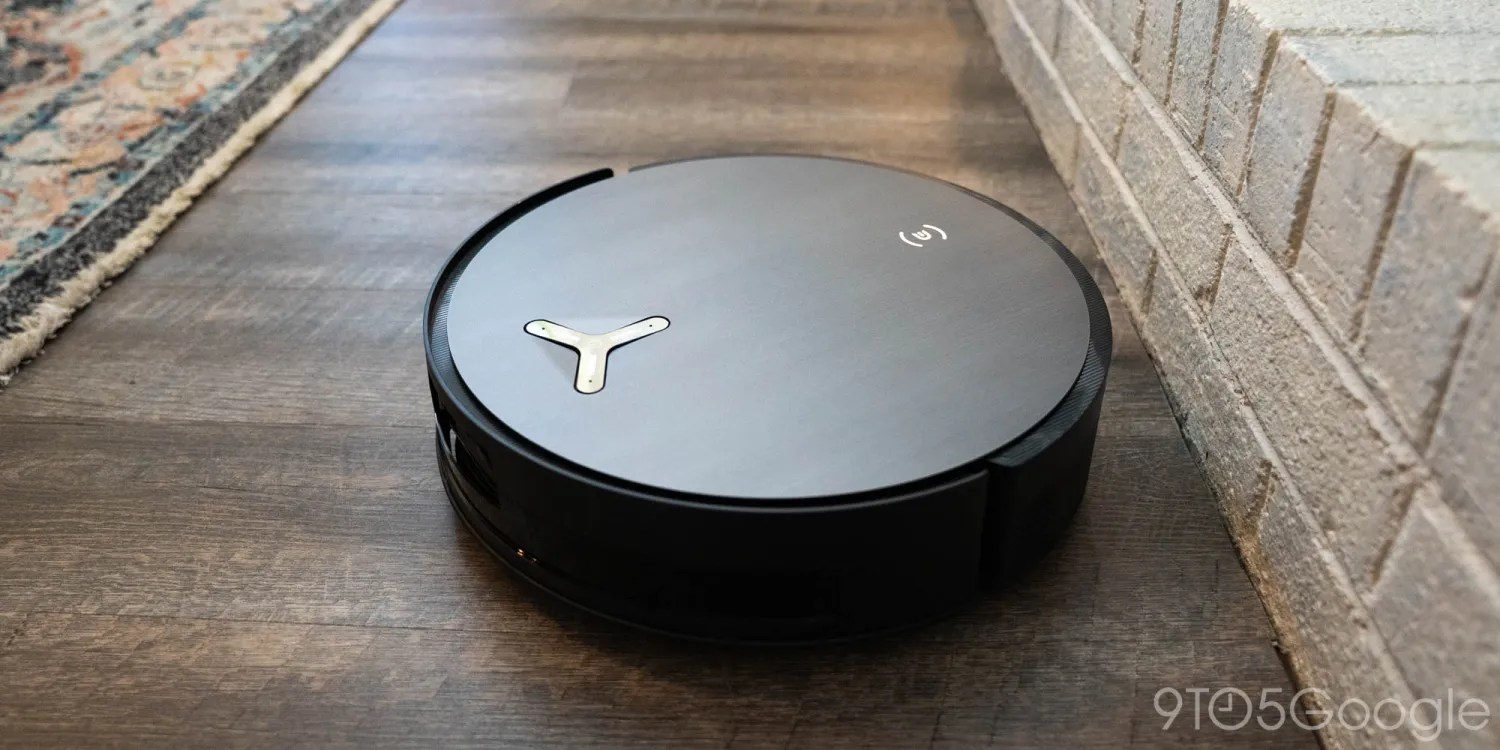 A black circular object on a wood floor