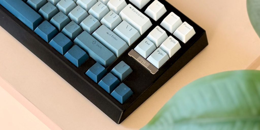 A keyboard with different colored keys.