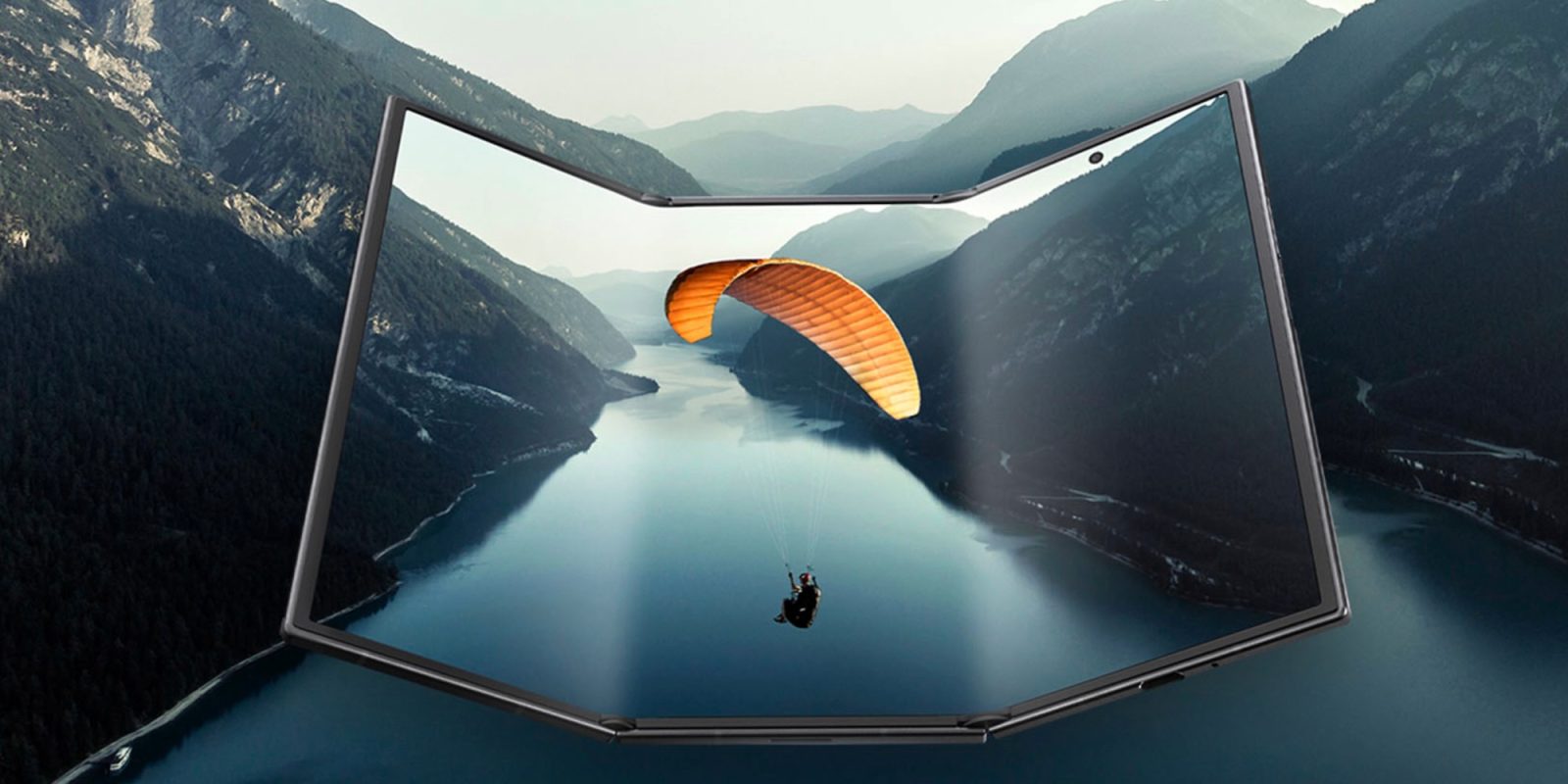 A person paragliding over a body of water