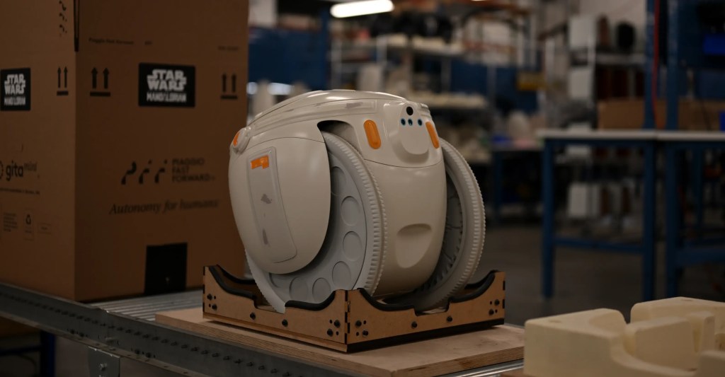 A white machine on a wooden surface