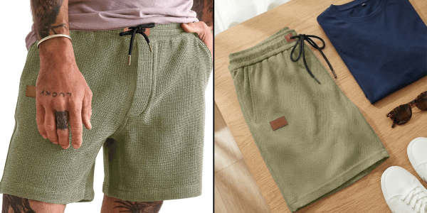 A man wearing shorts and a pair of shoes