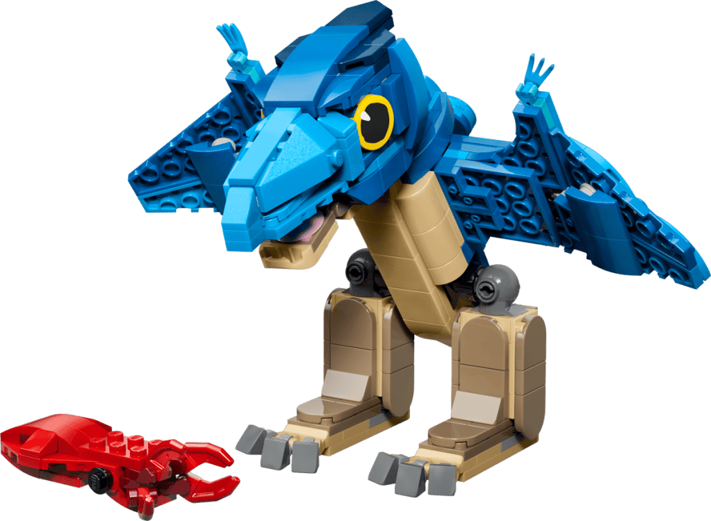 A toy dinosaur with a red crab